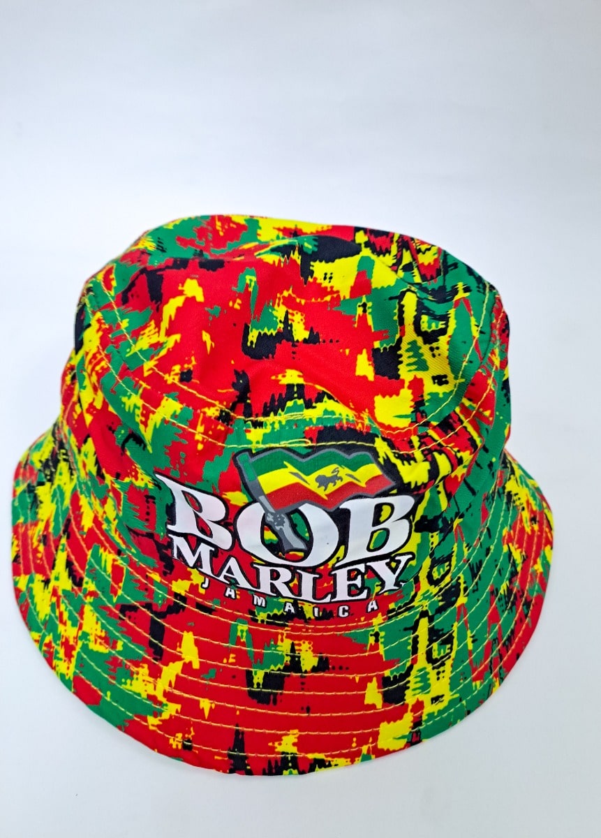 A vibrant bucket hat with a red, yellow, and green abstract pattern. The text Bob Marley Jamaica is printed on the front, featuring a small Jamaican flag.