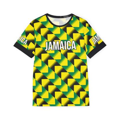 Front view of a Jamaica tribute jersey featuring a bold, all-over 'bruised banana' inspired geometric pattern in vibrant yellow, green, and black. The chest displays 'JAMAICA' in white block lettering with a black outline, finished with a clean black crew neck and matching sleeve cuffs for a classic retro-sport look.