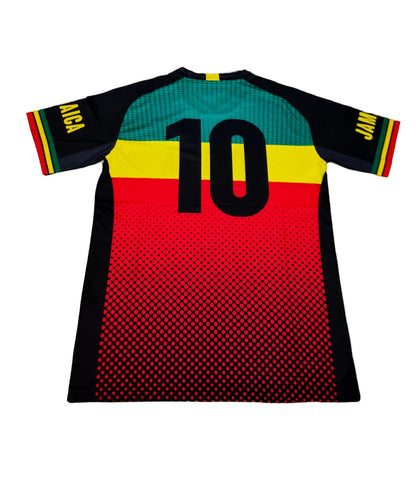 A soccer jersey (back) featuring a horizontal stripe pattern with red, yellow, green and black (Jamaican flag colors with Rasta colors) and the text '10' on the back.