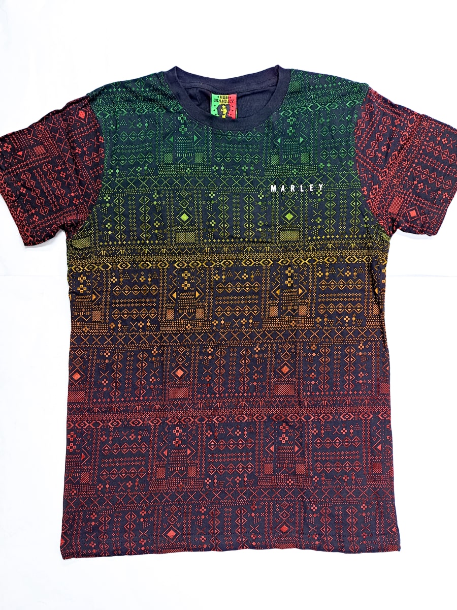 This 876 Worldwide t-shirt is inspired by reggae music and features intricate geometric patterns in shades of green, yellow, and red. The ombre design transitions vertically from green at the top to red at the bottom, with "MARLEY" printed on the upper right side.